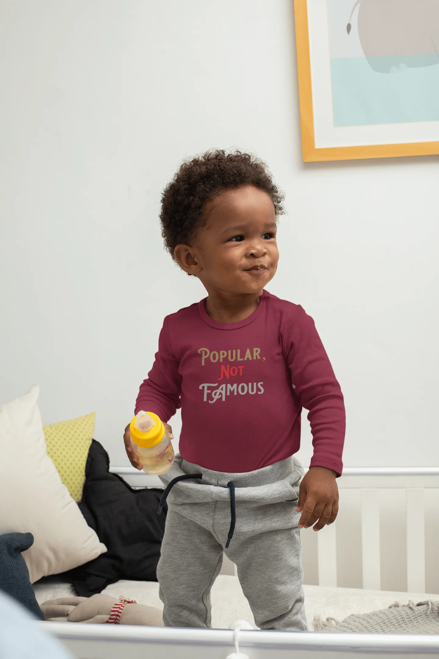 Infant Long Sleeve Bodysuit With “Popular Not Famous” Logo